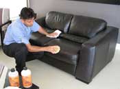 Man cleaning upholstery.