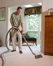 Man cleaning carpet.